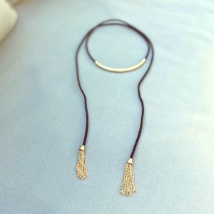 Black and gold lariat necklace with tassels